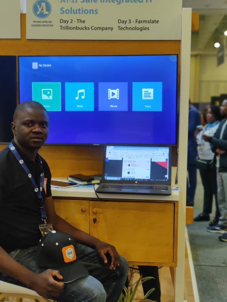 SIIS team member at the Safe Integrated IT Solutions stand with Brokerease branding